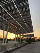 Solar Parking Structures provide shade and solar power in the parking lot of the Naples Zoo in Florida.