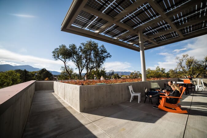 LSX Solar Canopy Structure provides shade over outside seating area where students study and talk outside of the Tutt Library.