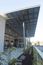 Solar Canopy with glass-glass solar panels covers the entryway at the Pastoria Building in California.