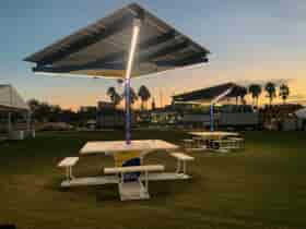 SolarZone Solar Recharge Stations on lawn during set up of Super Bowl LV Experience at Sunset in Florida