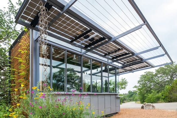 Solar Kiosk Admissions station with solar awning provides shade over ticket windows with foliage surrounding the building from the Living Roof.