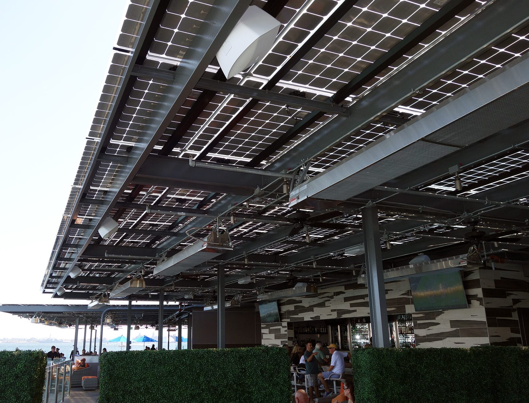 Solar Canopy with LSX Frameless Solar Module provides shade and solar power for guests at Coasterra Restaurant.