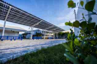 Stunning Front View of Modern Lumos SolarScape Drive-up Lane at Remodeled School in Miami, Florida