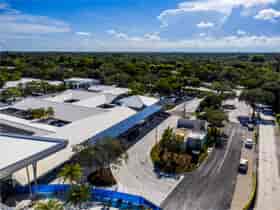 Ariel view of solar canopy drive-up lane at private academy provides weather protection and clean energy