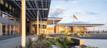 Solar walkway providing shade and power to the entrance of Veterans Affairs Clinic in Hawaii.